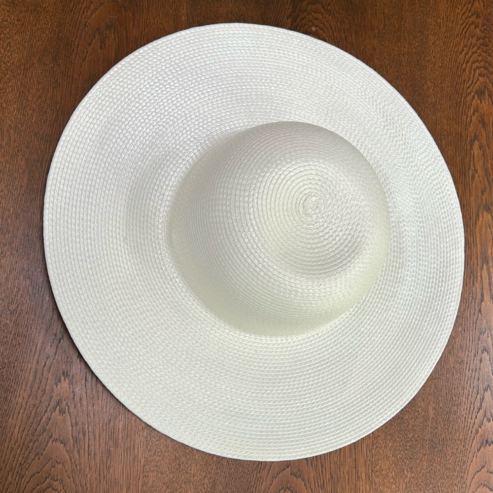 All white/pale cream 16” across sunhat. Polypropylene-this can get wet. 4”brim.